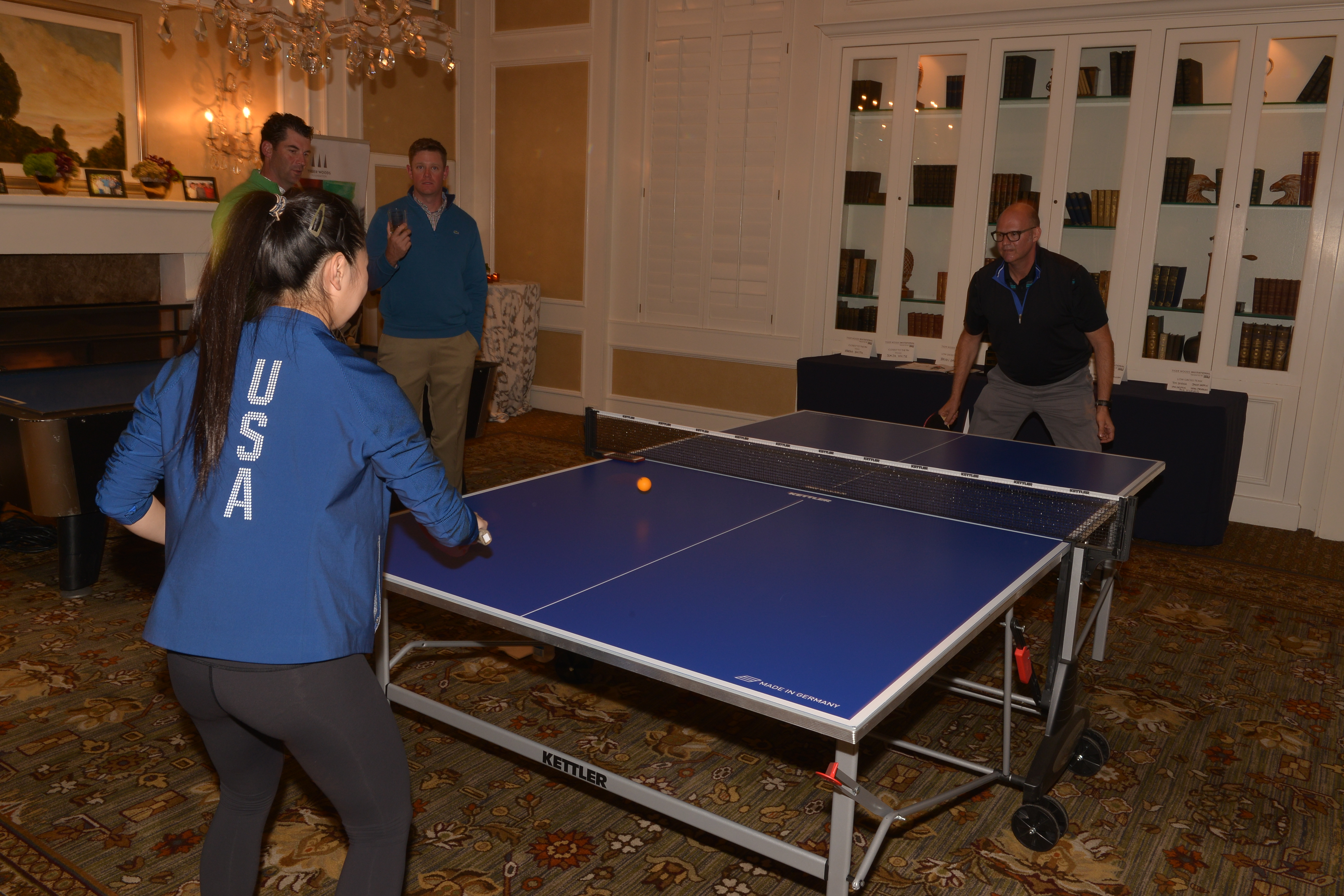 Table Tennis Olympian Lily Zhang playing with guests