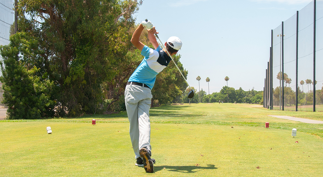 Junior Golfer hits of the tee in Anaheim