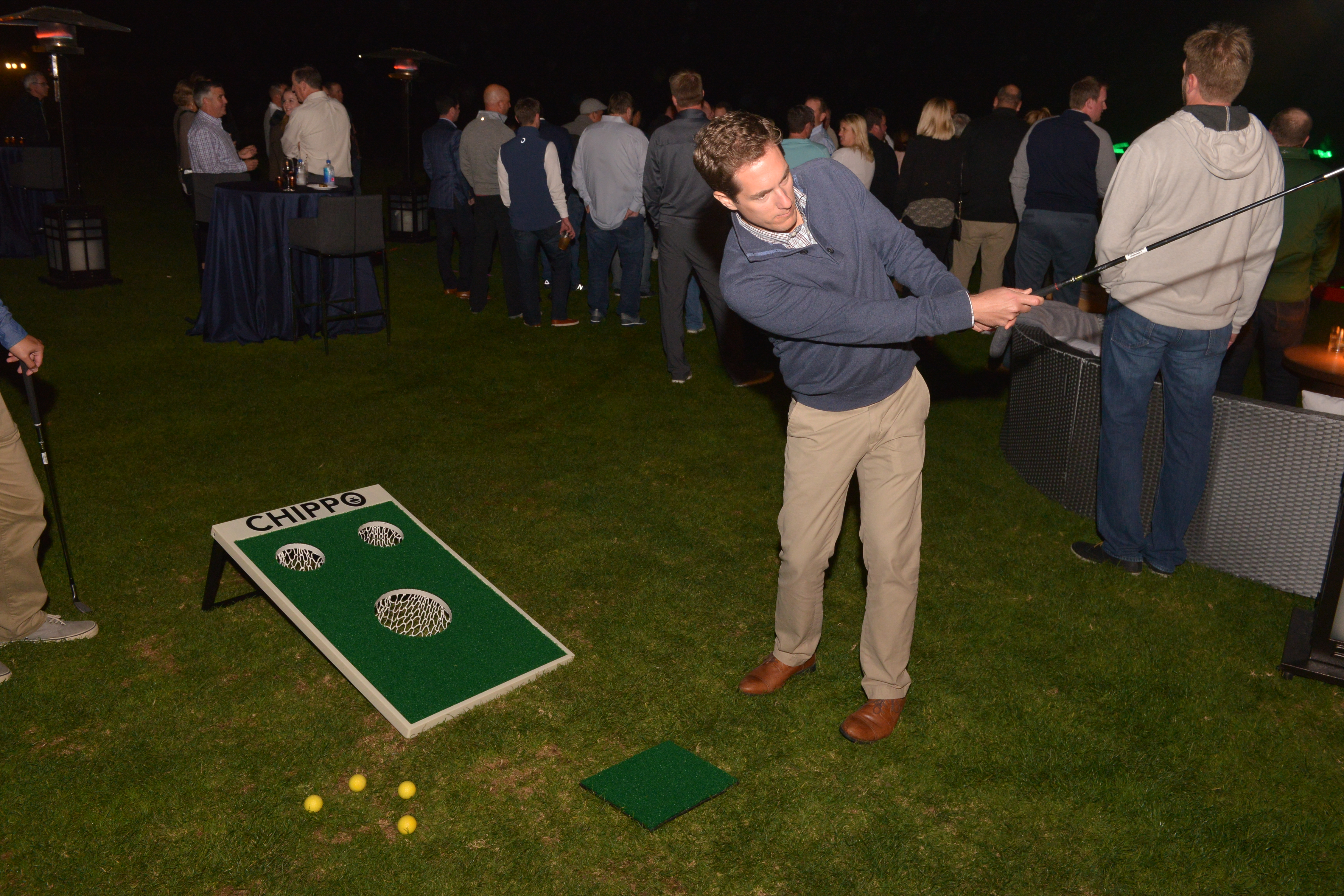 Guests enjoying Chippo Golf on the lawn at the Lodge