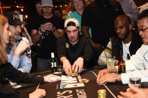 Draft Kings' Peter Jennings and Houston Rockets' Chris Paul at the final table during Tiger's Poker Night