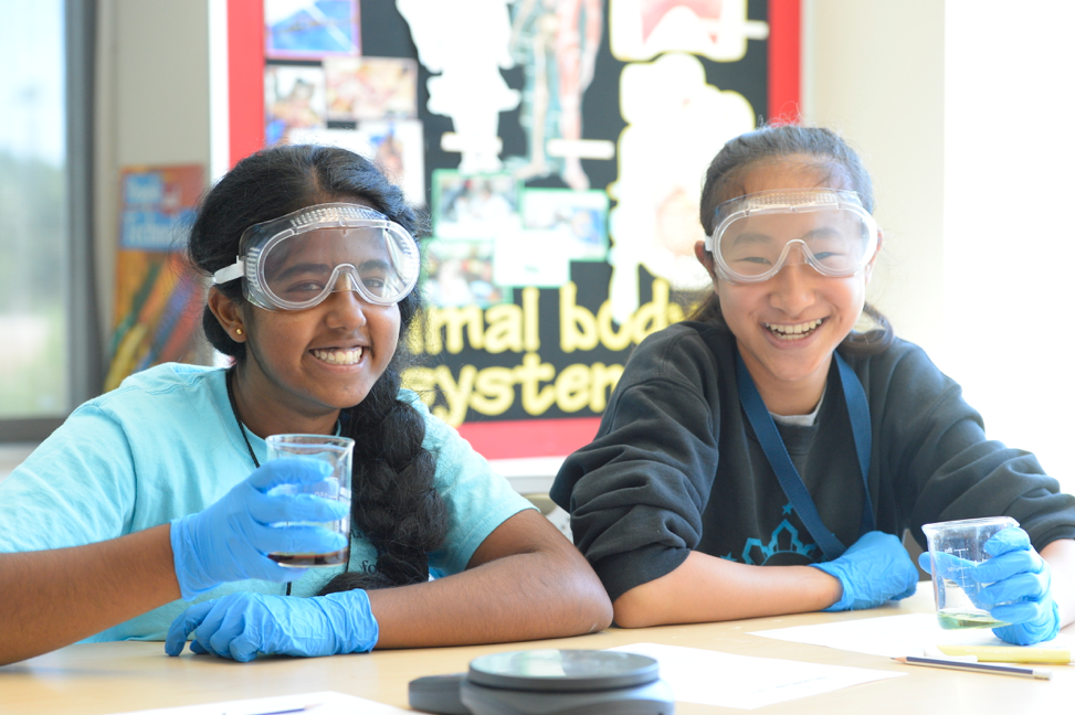 Female students work on science at the TGR Learning Lab